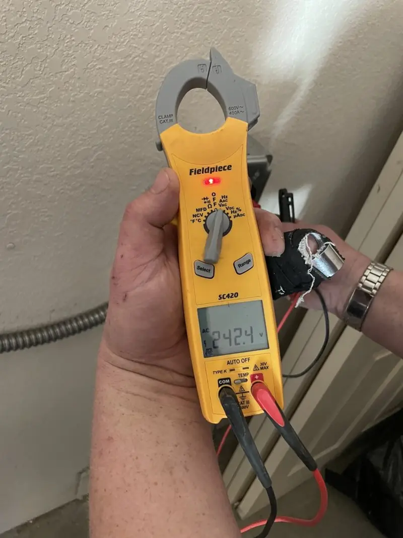 Voltage testing with clamp meter during Recessed Lighting Installation in North Richland Hills